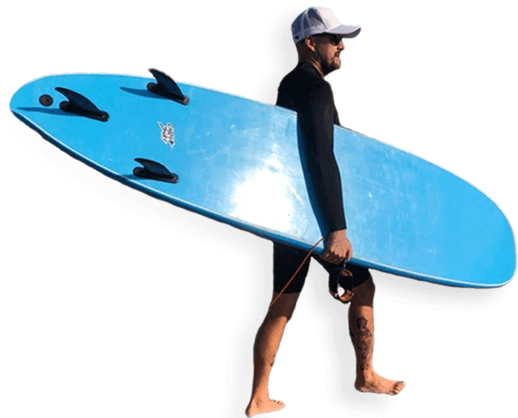 Photo of attorney Dylan Grimes carrying a surfboard