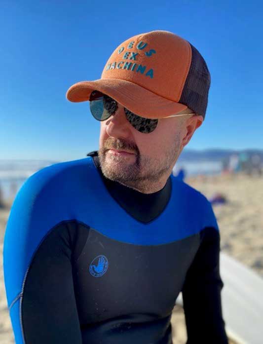 Photo of Attorney Dylan Grimes in surf gear